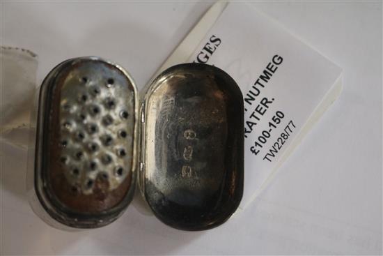 A George III bright cut engraved silver oval nutmeg grater, with hinged steel rasp, by Joseph Wilmore, 37mm.